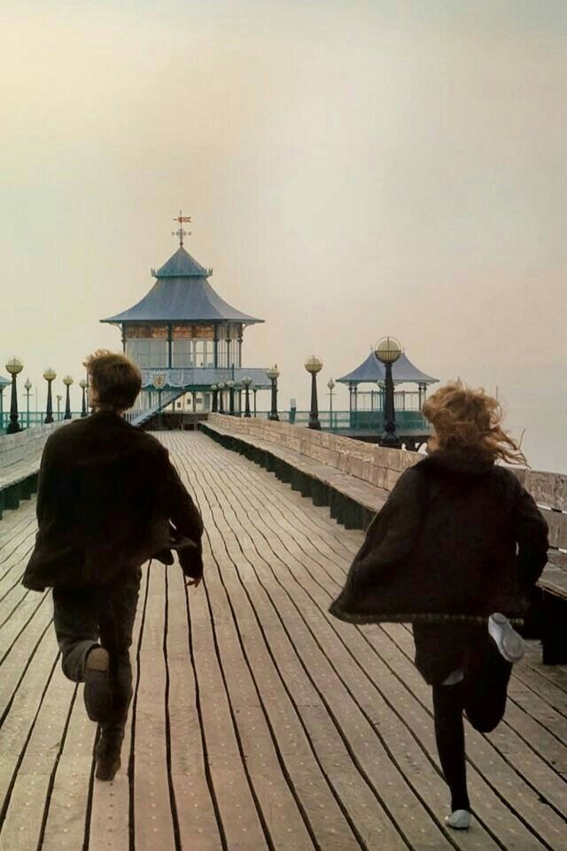 Scene from Never Let Me Go - two figures running on a pier